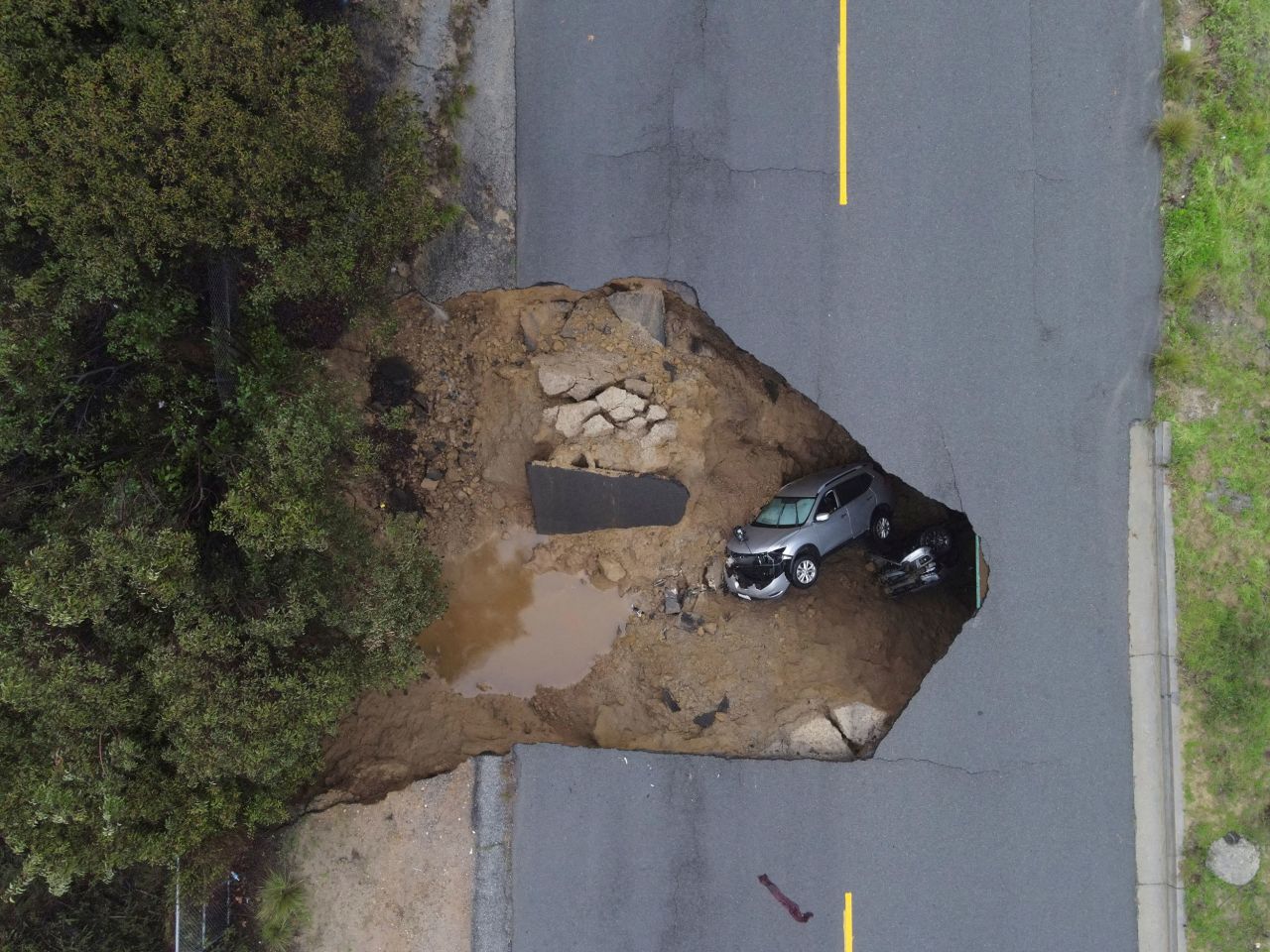 Several people had to be rescued after two vehicles fell into this sinkhole in Chatsworth, California, on Tuesday, January 10.